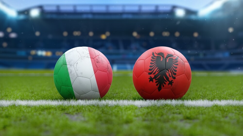 Soccer,Balls,With,Italy,And,Albania,Flags,On,Grass,Field