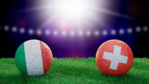 Two,Soccer,Balls,In,Flags,Colors,On,Stadium,Blurred,Background.