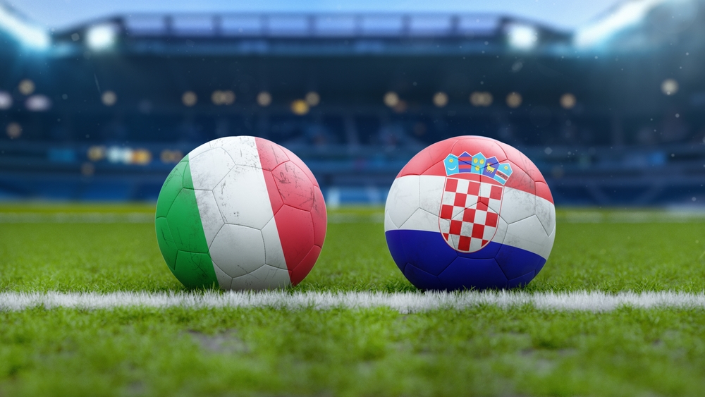 Soccer,Balls,With,Italy,And,Croatia,Flags,On,Grass,Field